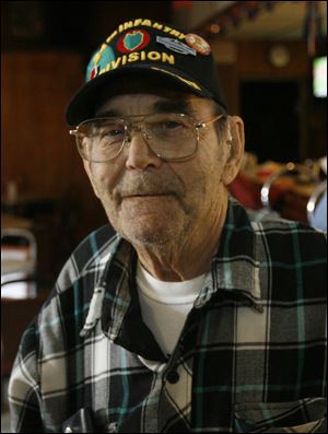 Toledoan Howard ‘Shorty' Braddock, 79, grew up during World War II and served in Korea. He says re-enactments mislead people about war. 