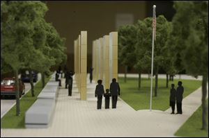 A scale-model view of Norman Lee's design that was considered to replace the Last Alarm memorial was presented three years ago.