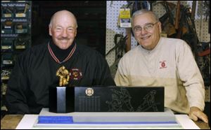 George Costic, left, and Bill Winkle would like to see a sculpture like the one pictured here in Chub DeWolfe Park.