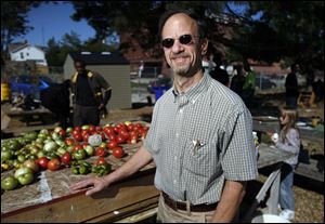 Terry Glazer, United North CEO, stops by a display of tomatoes from Oneida Greenhouse.