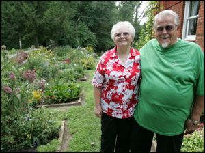 Marcella, left, and Clarence Mackey, who have about 3300 square feet of gardening beds at their Waterville, Ohio, home.