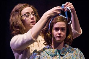 Ashley Campos, left, as Margo and Kelly Klein as Ann in 'The Diary of Anne Frank,' opening Saturday at the Valentine Theater. Julie Schroll will play Margot in the Toledo production.