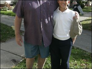 Retired police officer Lawrence 'Whitey' Knannlein stands with his grandson, Mason. The 11-year-old found a loaded handgun Wednesday near his North Lockwood Avenue home. He told a neighbor and stayed with the gun until police arrived. Mr. Knannlein has been teaching his grandson about gun safety since the boy was 7. 'I'm very proud of him,' Mr. Knannlein said.