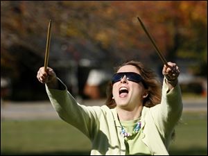 Tracy Elmore of Maumee plays a game of 'Graces' with her daughter Marissa, 10.