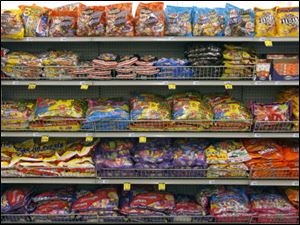 Bags of candy line Rite-Aid's shelves.