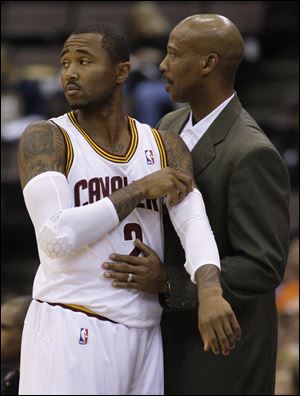 Coach Byron Scott talks with guard Mo Williams during an exhibition game. Scott is expecting Williams to be a strong performer.
