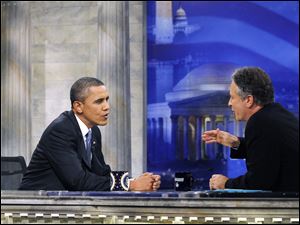 Jon Stewart tries to get President Obama to show off his humorous side during Mr. Obama's first appearance on the 'Daily Show with Jon Stewart' since taking office.