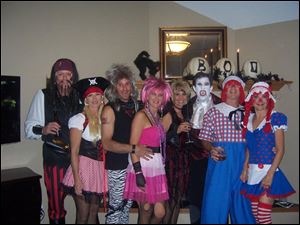 From left, Dave and Lisa Chandler, Scott and Brenna Seipel, Jody and Randy Shirk, and Ray and Toni Zammit at Joey Skaff's Halloween party.

<img src=http://www.toledoblade.com/graphics/icons/photo.gif> <font color=red><b>PHOTO GALLERY:</b></font> AROUND TOWN: <a href=