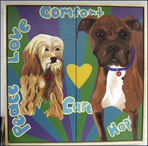 Students in the Arts Commission of Greater Toledo's Young Artists at Work program created several murals for the Lucas County Dog Warden's offices.