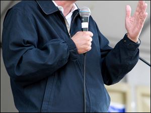 John Kasich, Republican challenger for governor, addresses a Tea Party rally in Cincinnati that he dropped in on for a surprise visit.