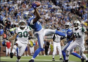 Detroit wide receiver Nate Burleson catches a two-yard touchdown pass against the New York Jets in the fourth quarter.