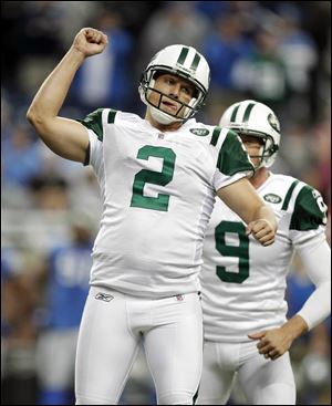 The Jets' Nick Folk reacts after his 30-yard field goal beat the Lions. He also connected to send the game into overtime.