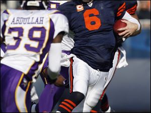 Bears QB Jay Cutler is looking for an escape route as Vikings safety Husain Abdullah (39) closes. The Bears won 27-13.