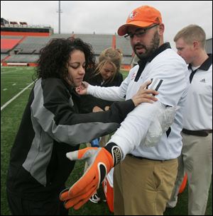 CTY compete15p    The Blade/Lori King  11/14/2010  BGSU's Brittany Urbania wraps the arm of David Florea during the ice relay, during the UT vs. BGSU Athletic Trainers competition at BGSU.