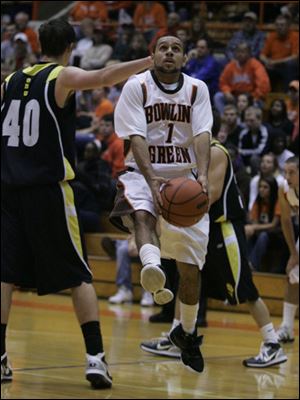 Ohio Dominican's Zak Kapron steps in to cut off Jordon Crawford's path to the basket.
