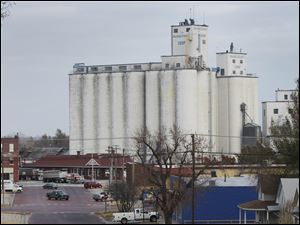 Farmers are growing more corn and keeping the grain because of ethanol, spurring additions to elevators like these in Kansas.