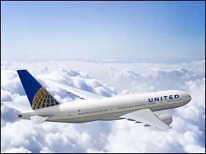 A jetliner wears the fleet's new look. Some Continental planes will need only the name replaced by United; United jets will have the previous insignia replaced.