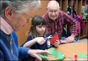 CTY grand15p   The Blade/Lori King  12/15/2010  From left: Mary Hasenfratz, kindergartner Shaylie Lemons and Len Hasenfratz make a Christmas decoration together during grandparent's day at Grove Patterson Elementary in Toledo, Ohio. Mary and Len are the grandparents of Shaylie.