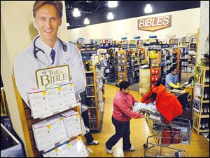 Customers shop for Christian-themed gifts at the Potomac Adventist Book & Health Food Store in Silver Spring, Md. There have been no blockbusters to drive religious-related sales this holiday season.