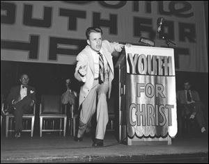 The Rev. Billy Graham, shown at 27 during a sweep across the country in 1947, is among several religious leaders profiled in 'God in America,' the PBS program which looks at the relationship between faith and democracy. He has advised the nation's presidents for decades.