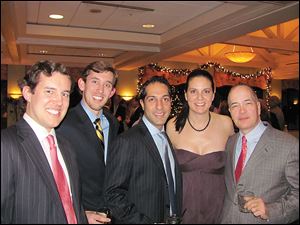 From left, David Treece, Ben Treece, Amir Khan, Susan Pond, and Allan Block at Mr. Block's holiday party. <br> <img src=http://www.toledoblade.com/graphics/icons/photo.gif> <font color=red><b>PHOTO GALLERY:</b></font> ON THE TOWN: <a href=