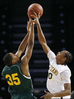 Start's Maurice Taylor, right, tips away a shot by John Hay's Chaz Rollins. Taylor was one of three Spartans to score 10 points.
<br>
<img src=http://www.toledoblade.com/graphics/icons/photo.gif> <font color=red><b>VIEW GALLERY:</b></font> <a href=