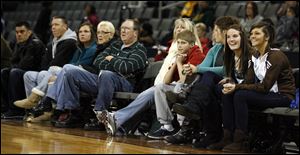 A group of fans smiles from courtside seats in the downtown Toledo arena. The event was revived this year after not having been staged since 1997.