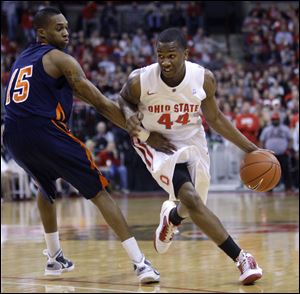 Ohio State's William Buford drives to the basket against Tennessee-Martin's Reuben Clayton. It was the ninth-biggest victory in school history.