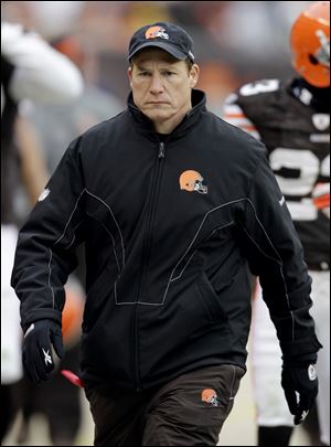 Eric Mangini leaves the field after the Browns were pummeled by the Steelers. Mangini will meet Mike Holmgren Monday morning. 