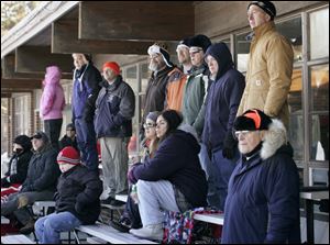 CTY roving10p 1/9/11  The Blade/Dave Zapotosky Well bundled spectators watch the hockey action during the Winter Chill Outdoor Festival at Ottawa Park Ice Rink, Sunday, January 9, 2011. 47 youth hockey teams played 28 games during the festival which ran fromThursday through Sunday. Teams from Pennsylvania, Indiana, Michigan, and Ohio, ranging in age from 8-17, participated in the event.