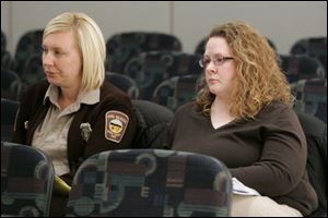 Lucas County Dog Warden Julie Lyle, right, and her assistant, Jessica Poupard, at the meeting Tuesday.