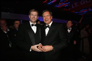 Lucas County Republican Chairman Jon Stainbrook and Governor Kasich share a moment at the inaugural gala after the ceremony.