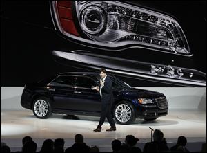 Chrysler's Olivier Francois quotes a little of Detroit's own Eminem as he speaks about the new Chrysler 300 at the North American International Auto Show in Detroit.