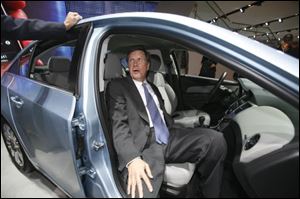 Gov. Kasich tries out the passenger seat of the Chevy Cruze.