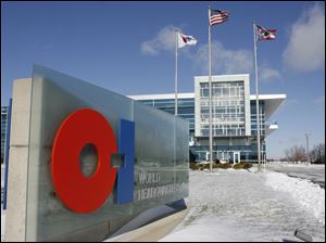 Owens-Illinois, headquartered in Perrysburg, above, said earnings from continuing operations in 2010 were up sharply from 2009.