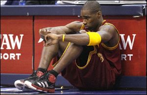 Cleveland Cavaliers power forward Antawn Jamison (4) sits in front of the scorer's tables waiting to be subbed in during the first half of the NBA basketball game against the Dallas Mavericks in Dallas.
