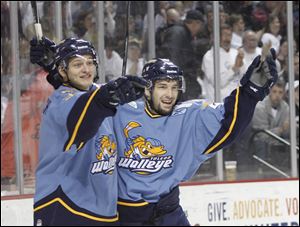 Andy Bohmbach, left, and Mike Hedden celebrate Bohmbach's first-period goal to put Toledo ahead early.
