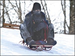 Luke Roberts, from Oregon, hits the slopes with his 2-year-old dog, Indy.