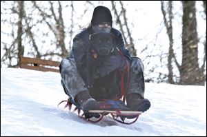 Luke Roberts, from Oregon, hits the slopes with his 2-year-old dog, Indy.