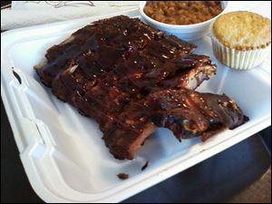 Barbecue ribs with home-style baked beans and cornbread at Deet's BBQ in Maumee.