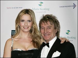 Rod Stewart, right, and his wife Penny Lancaster have a new baby boy named Aiden.