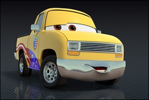 John Lassetire is a yellow pickup truck with an American flag motif on its side.
