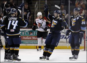 Toledo's Mike Hedden, right, celebrates scoring a goal against Wheeling at the Huntington Center.