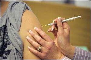 More people have gotten flu shots, officials say, because of awareness from last season.
