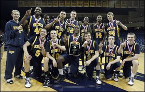 The Whitmer Panthers took the City League title with a 51-48 win over the St. John's Jesuit Titans.