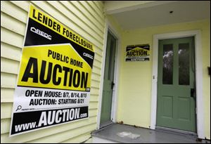 A foreclosed home in Chagrin Falls, Ohio, sits waiting for auction.