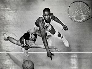 Nate Thurmond swats away a shot by a Miami player in 1962. Thurmond was a Sporting News All-American as a Bowling Green senior.