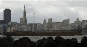 A tanker steams past the San Francisco skyline Thursday, as seen from Treasure Island in San Francisco Bay.