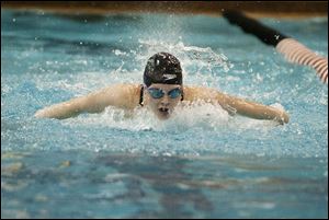 Napoleon's Makenzie Garringer heads for the finish in the 100-yard butterfly in the Division II state swimming championships.