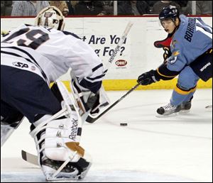 The Walleye's Andy Bohmbach moves in for a shot on Greenville goalie Nic Riopel, who earned his second shutout of the season. He stopped 24 Toledo shots.
